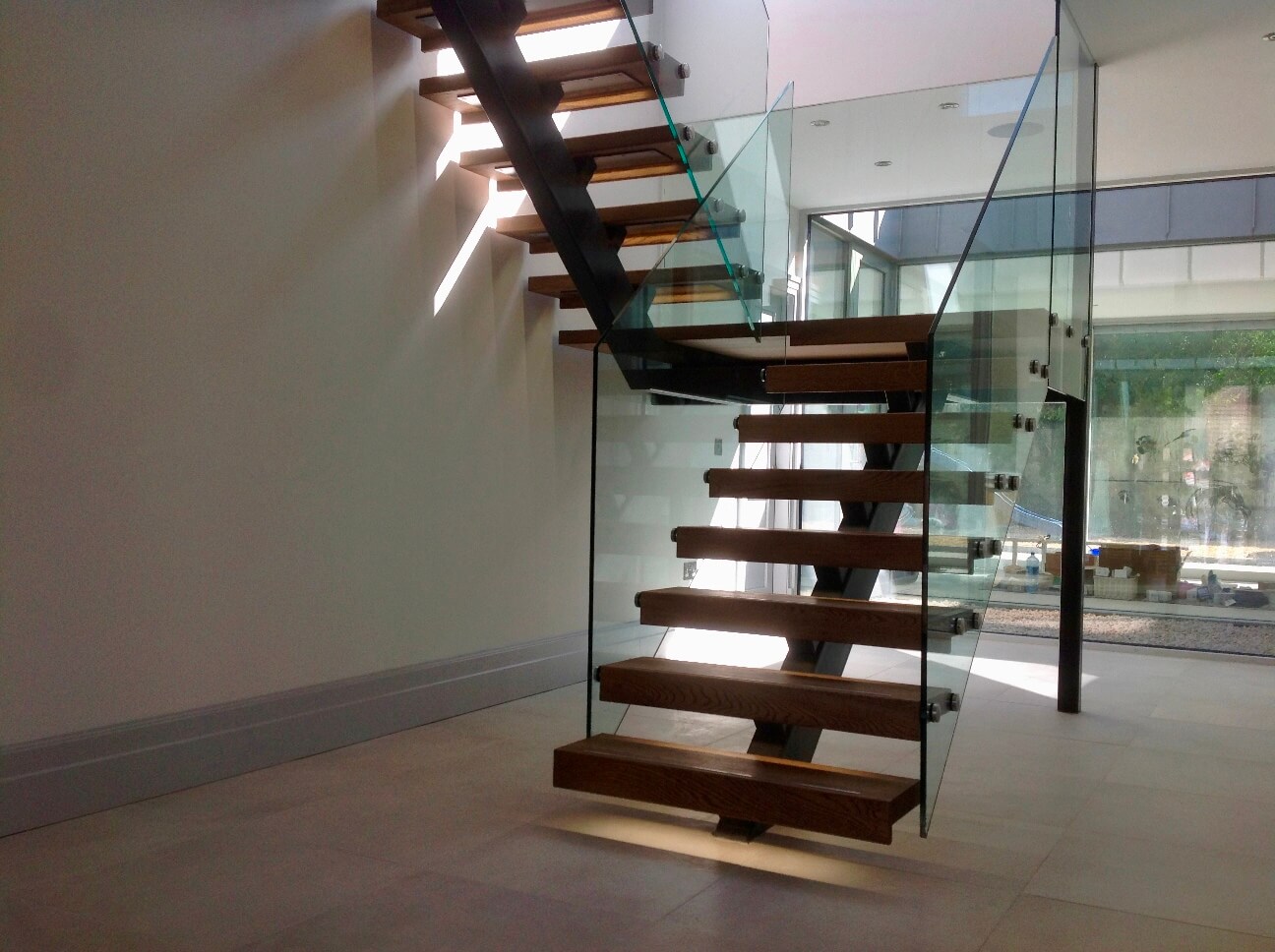 Grey Steel Spine Stairs with Glass Balustrade Staircase Design and